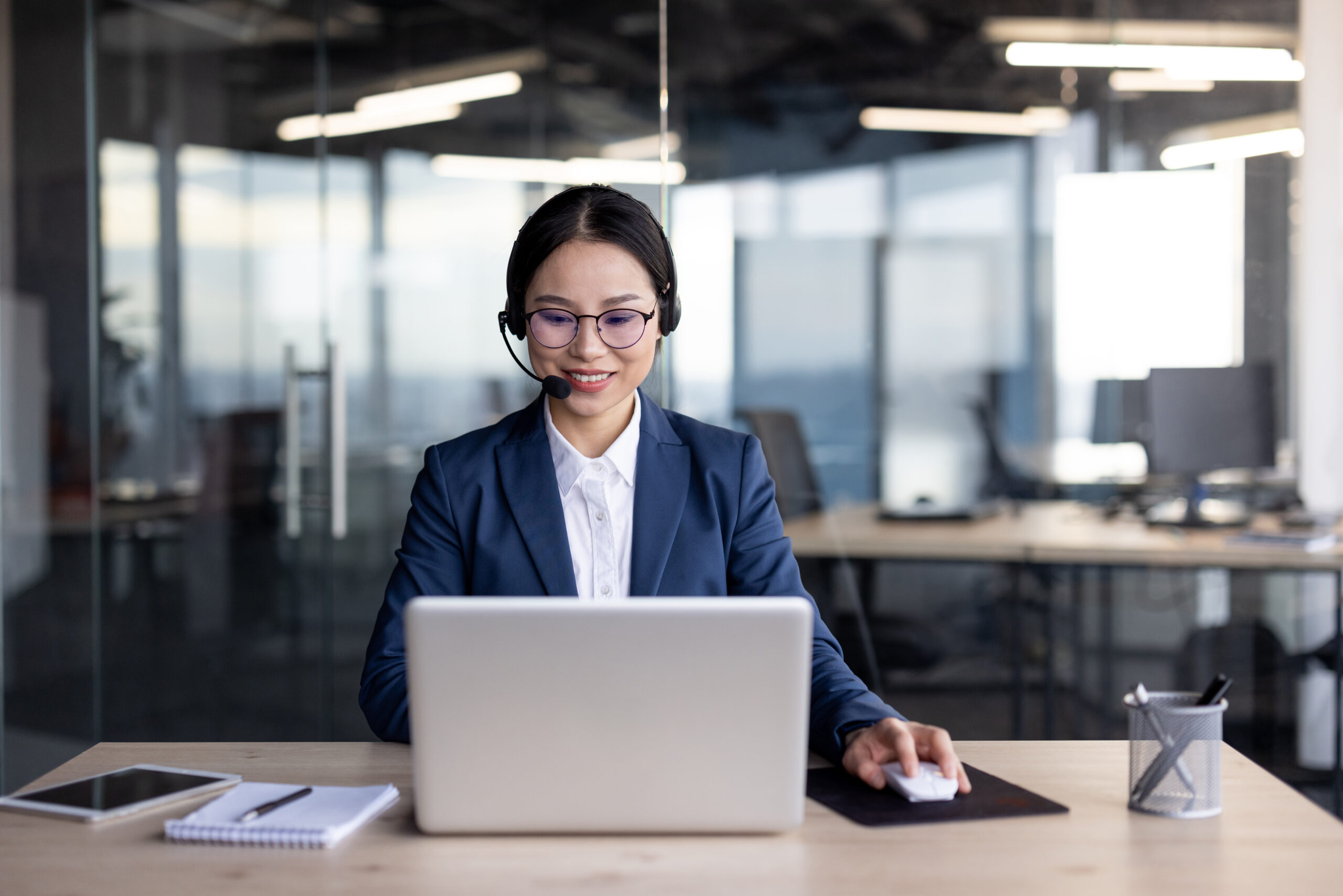 asian businesswoman working at office desk with la 2024 08 12 19 14 55 utc scaled
